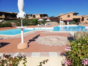 Snug holiday home in Marinella with shared pool